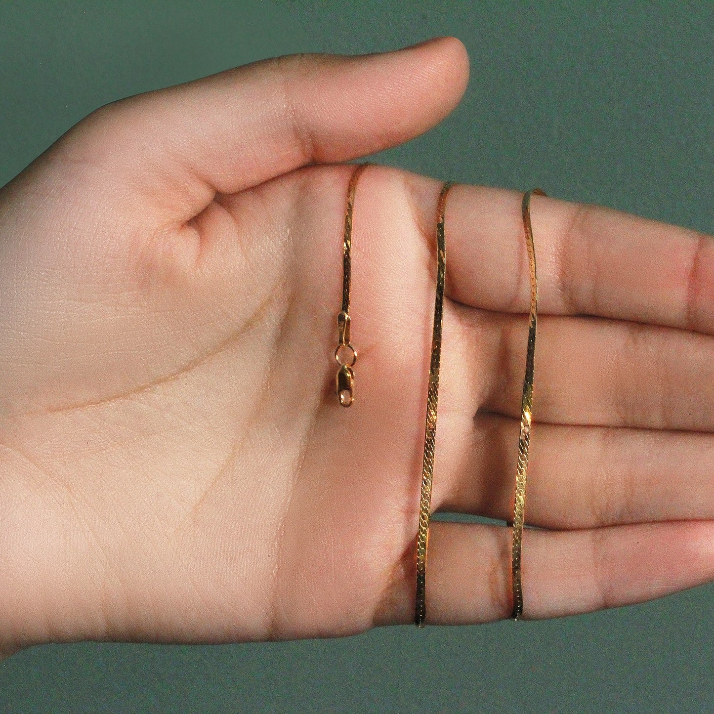 Peelerie jewelry piece in midnight luxury editorial product photo, high-contrast studio lighting