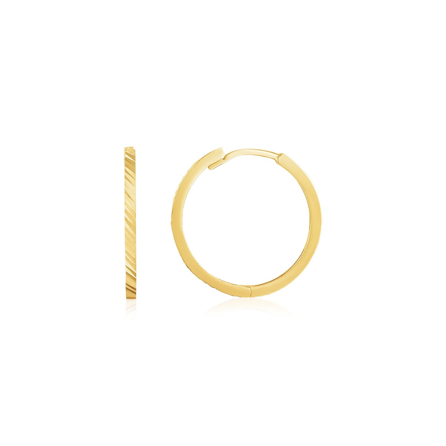 14k Yellow Gold Diamond Cut Textured Huggie Earrings in a sleek high-contrast midnight luxury editorial style