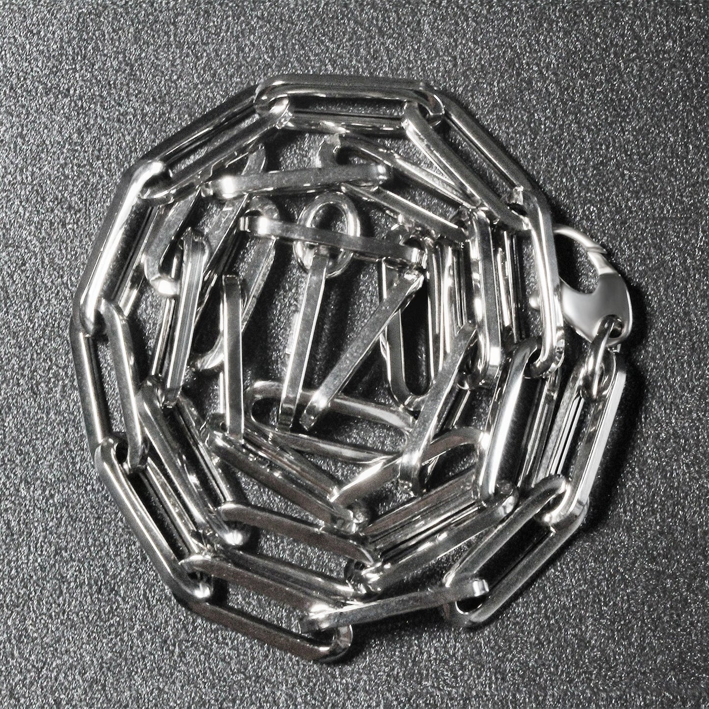 Peelerie jewelry piece in midnight luxury editorial product photo, high-contrast studio lighting