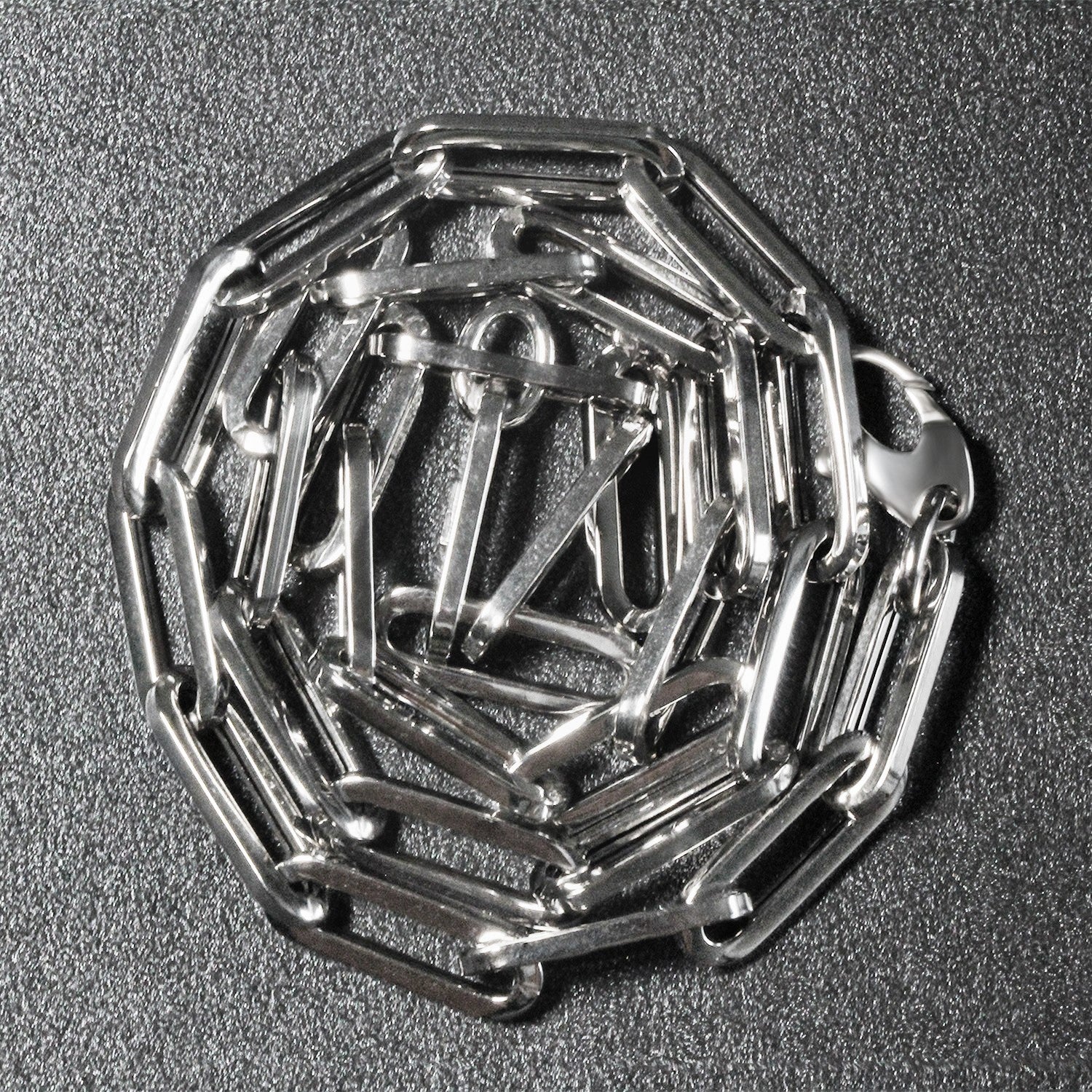 Peelerie jewelry piece in midnight luxury editorial product photo, high-contrast studio lighting