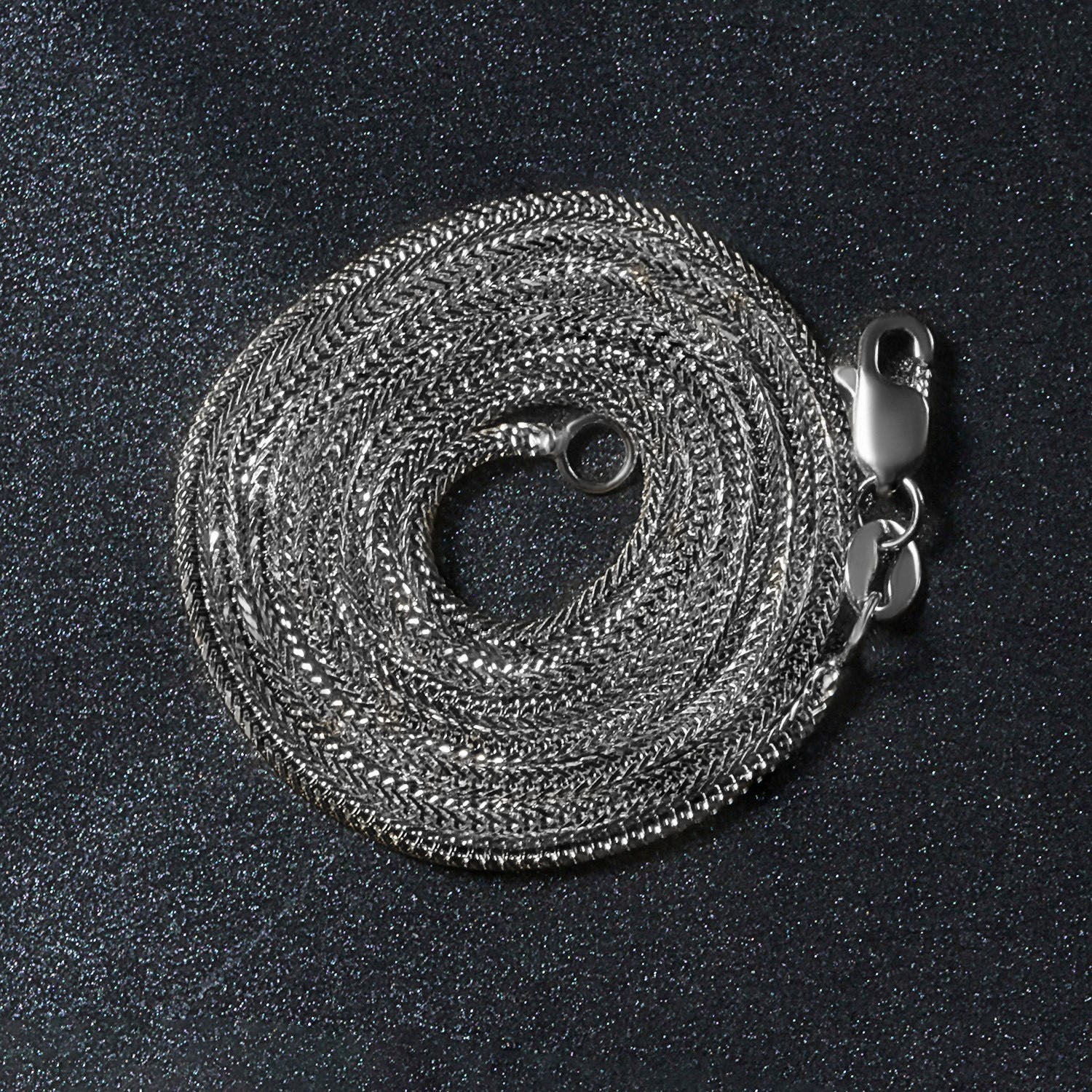 Peelerie jewelry piece in midnight luxury editorial product photo, high-contrast studio lighting