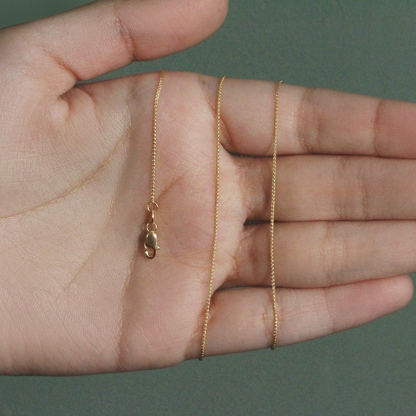 Peelerie jewelry piece in midnight luxury editorial product photo, high-contrast studio lighting