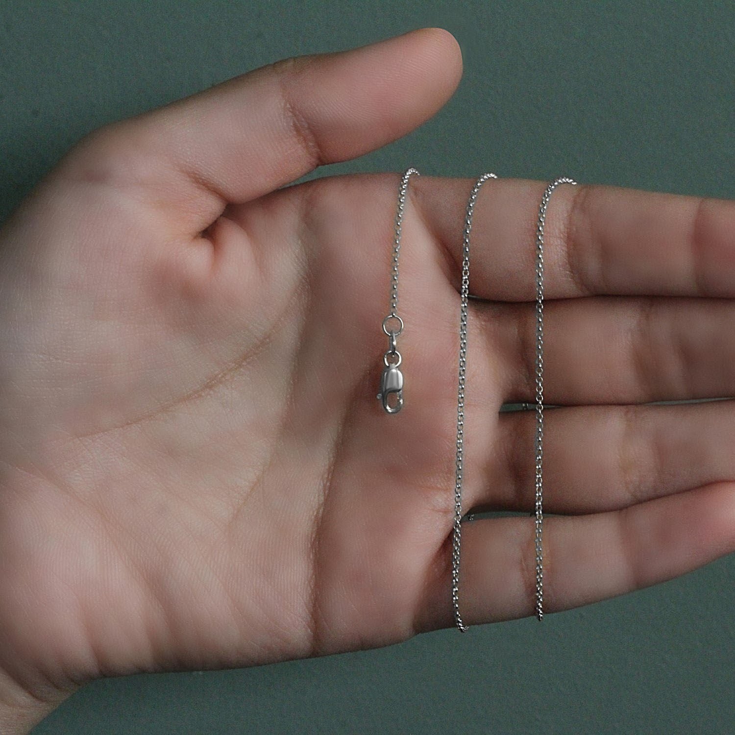 Peelerie jewelry piece in midnight luxury editorial product photo, high-contrast studio lighting