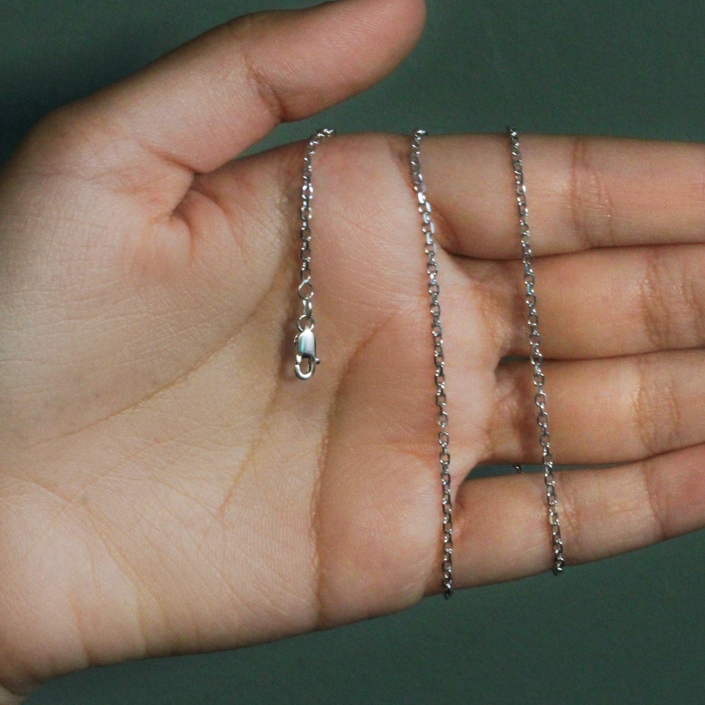 Peelerie jewelry piece in midnight luxury editorial product photo, high-contrast studio lighting