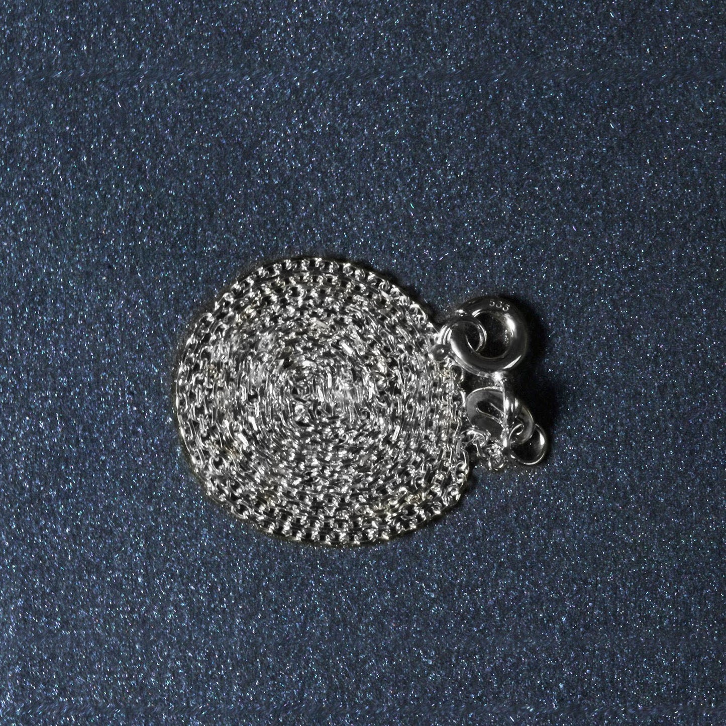 Peelerie jewelry piece in midnight luxury editorial product photo, high-contrast studio lighting