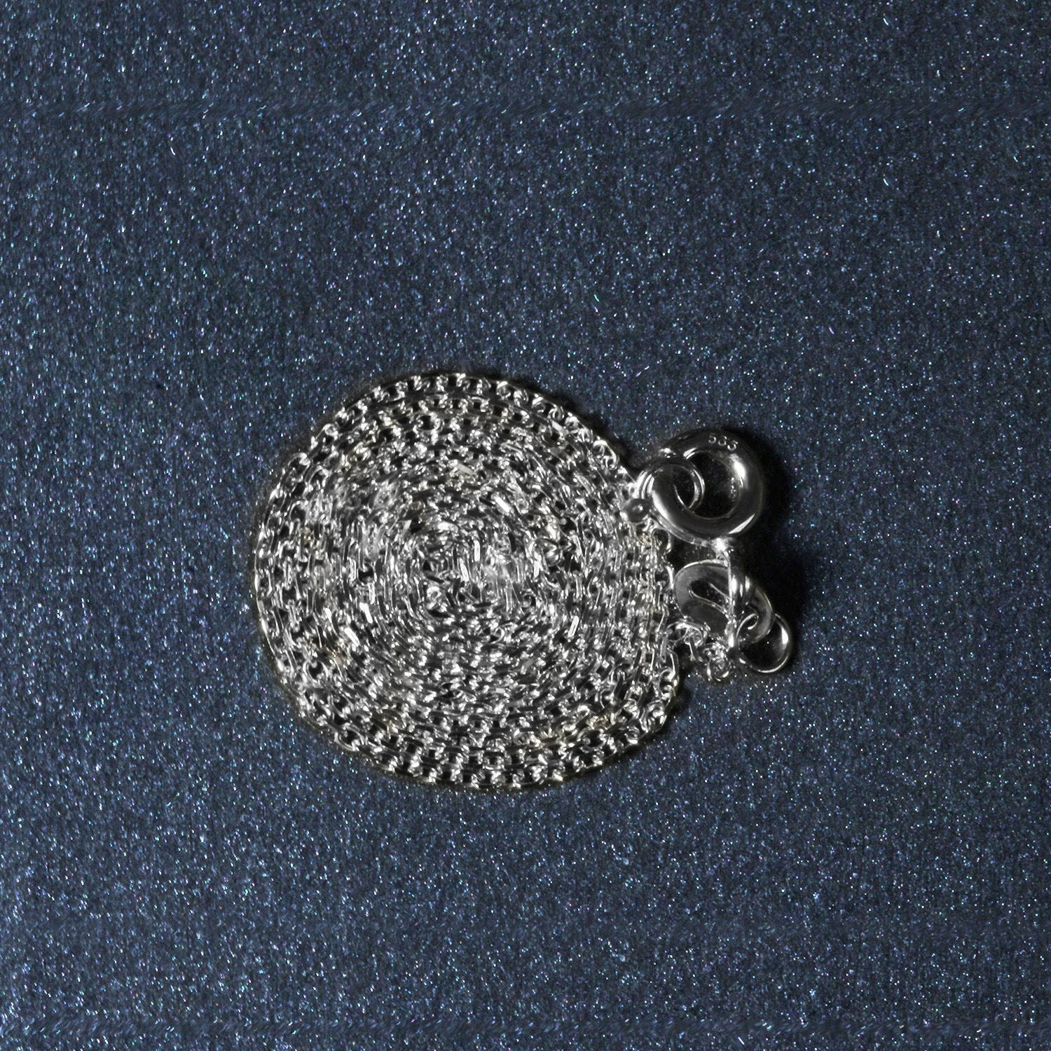 Peelerie jewelry piece in midnight luxury editorial product photo, high-contrast studio lighting