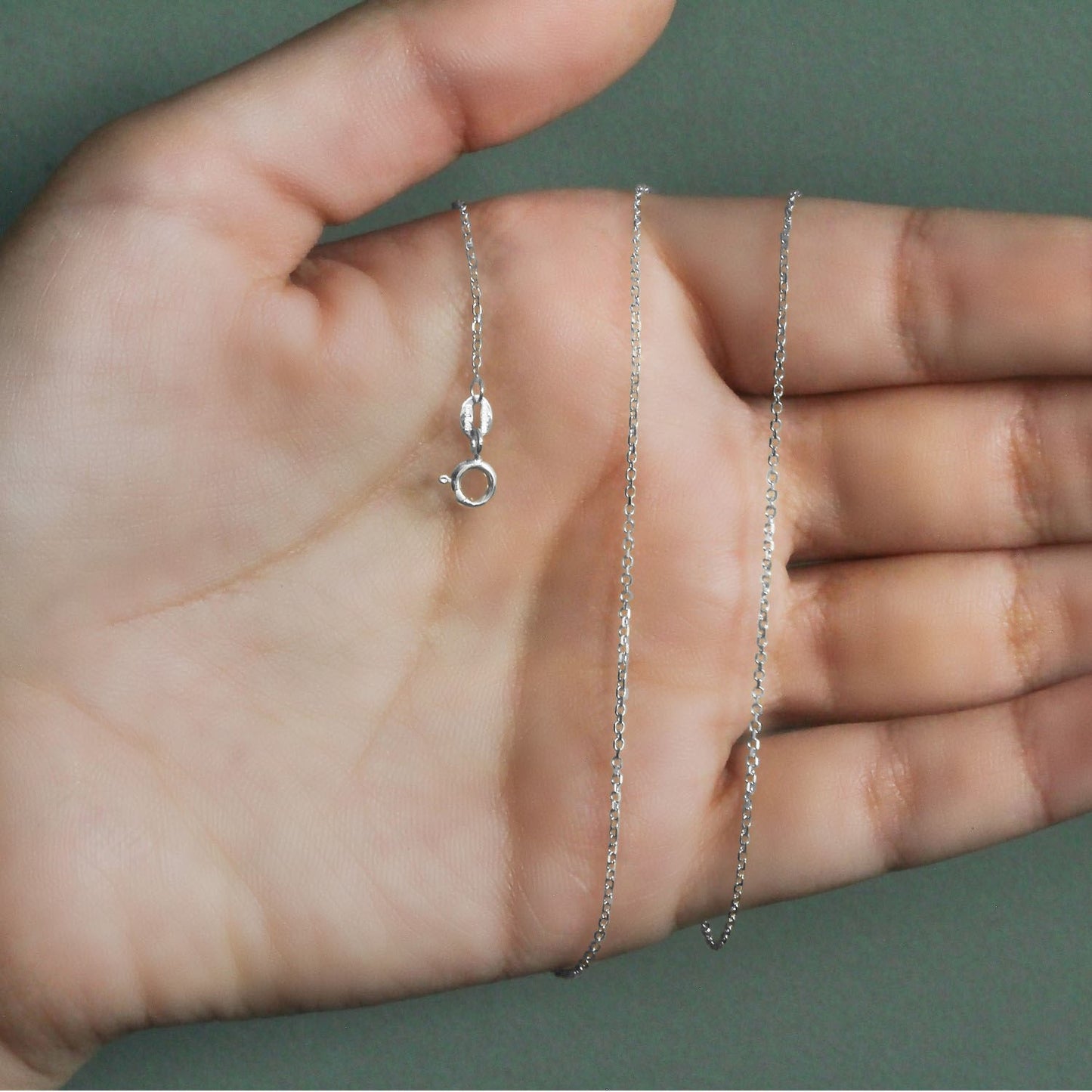 Peelerie jewelry piece in midnight luxury editorial product photo, high-contrast studio lighting