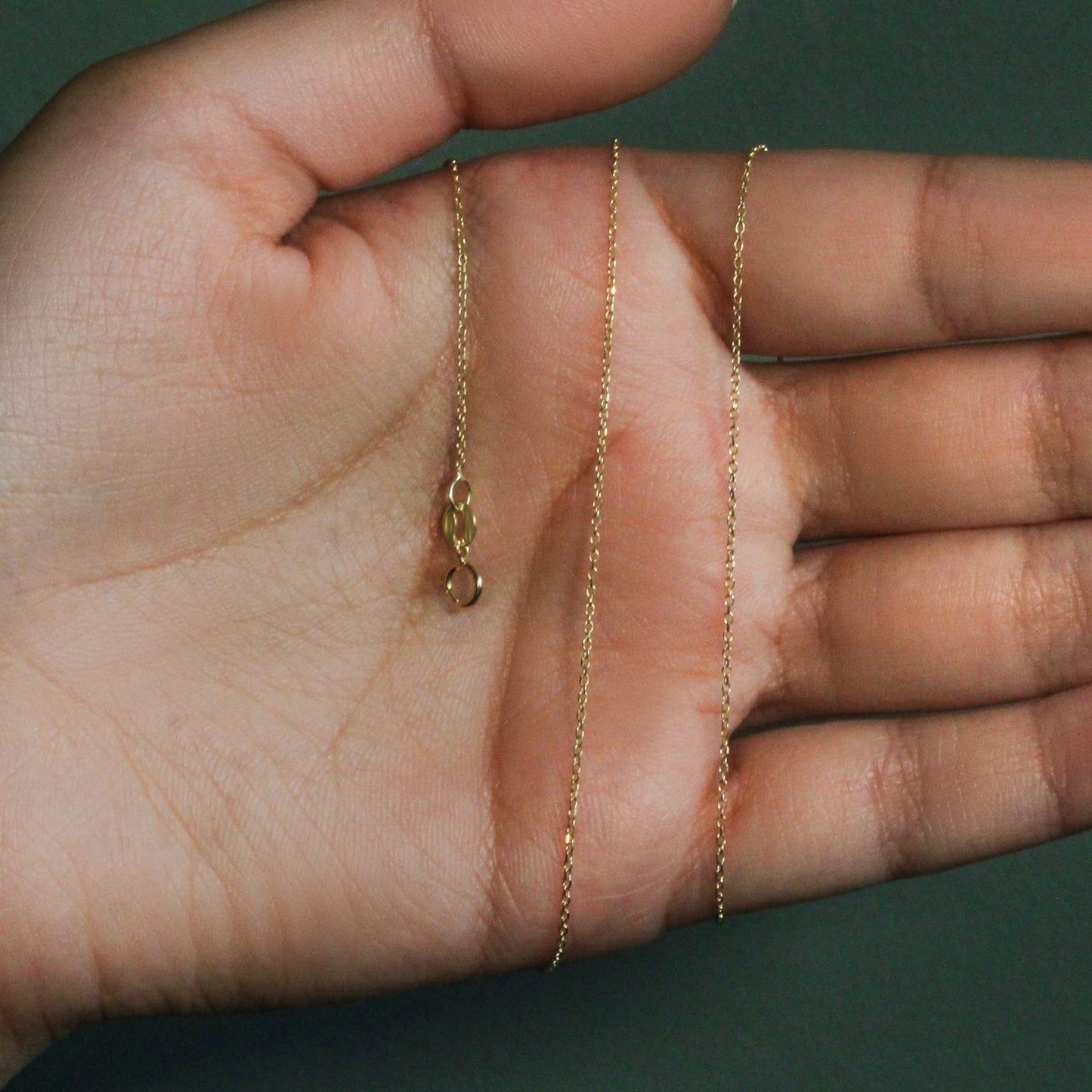 Peelerie jewelry piece in midnight luxury editorial product photo, high-contrast studio lighting