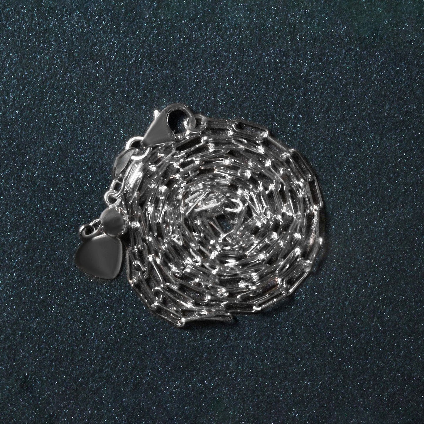 Peelerie jewelry piece in midnight luxury editorial product photo, high-contrast studio lighting