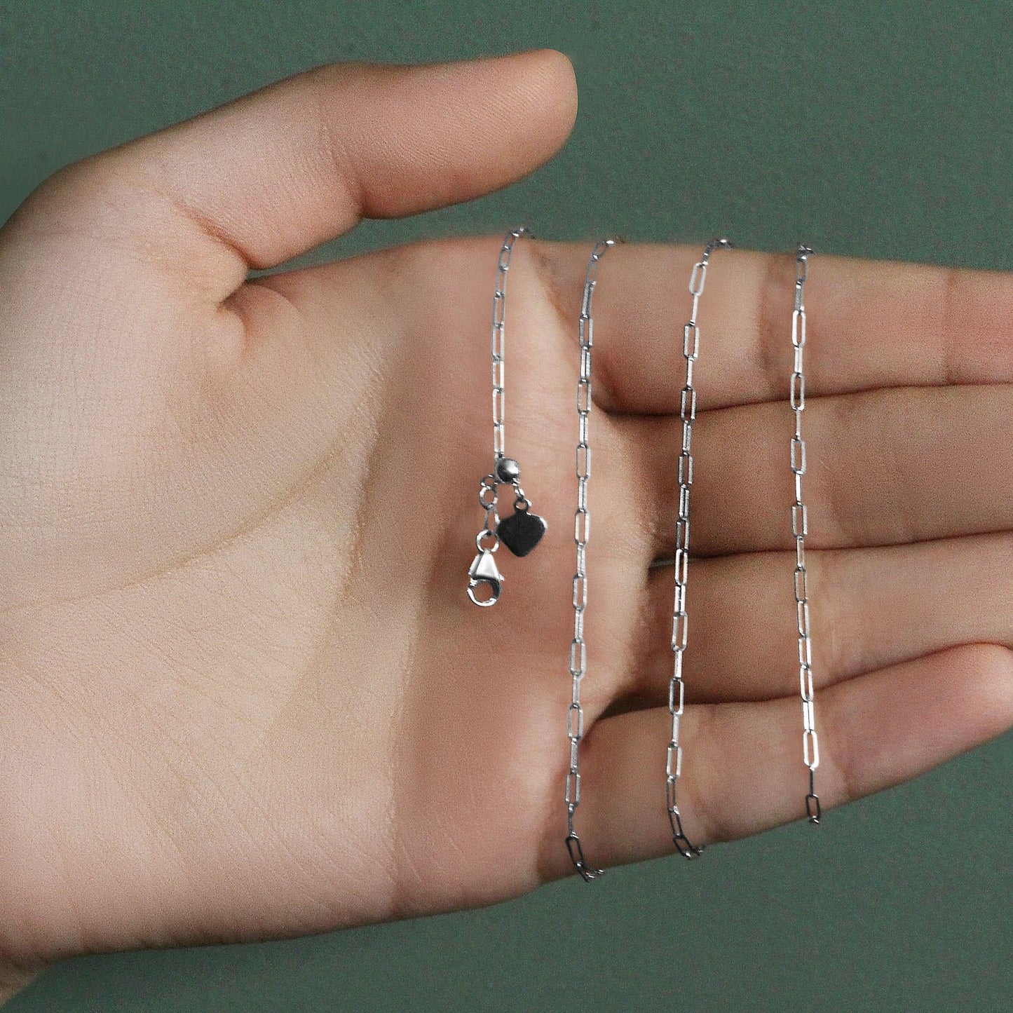 Peelerie jewelry piece in midnight luxury editorial product photo, high-contrast studio lighting