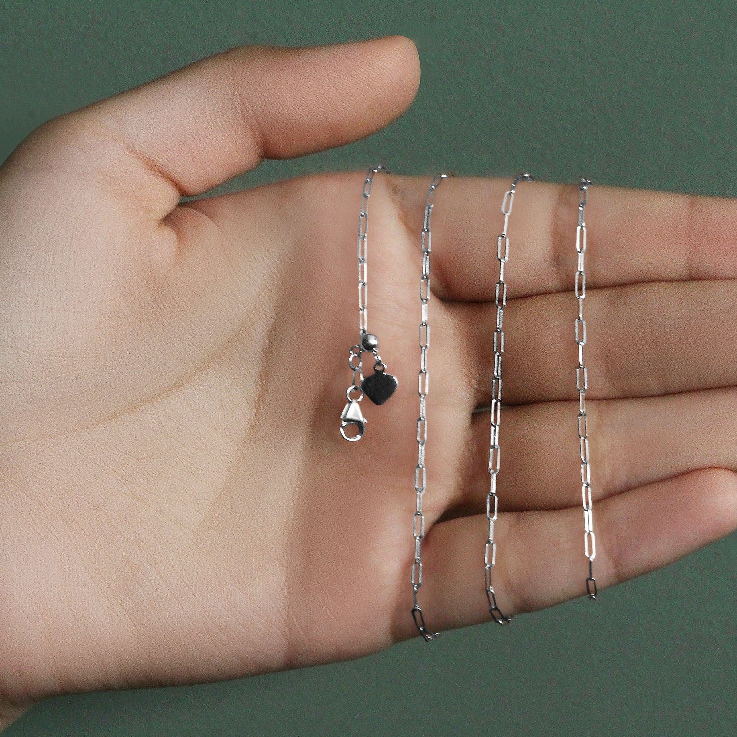 Peelerie jewelry piece in midnight luxury editorial product photo, high-contrast studio lighting