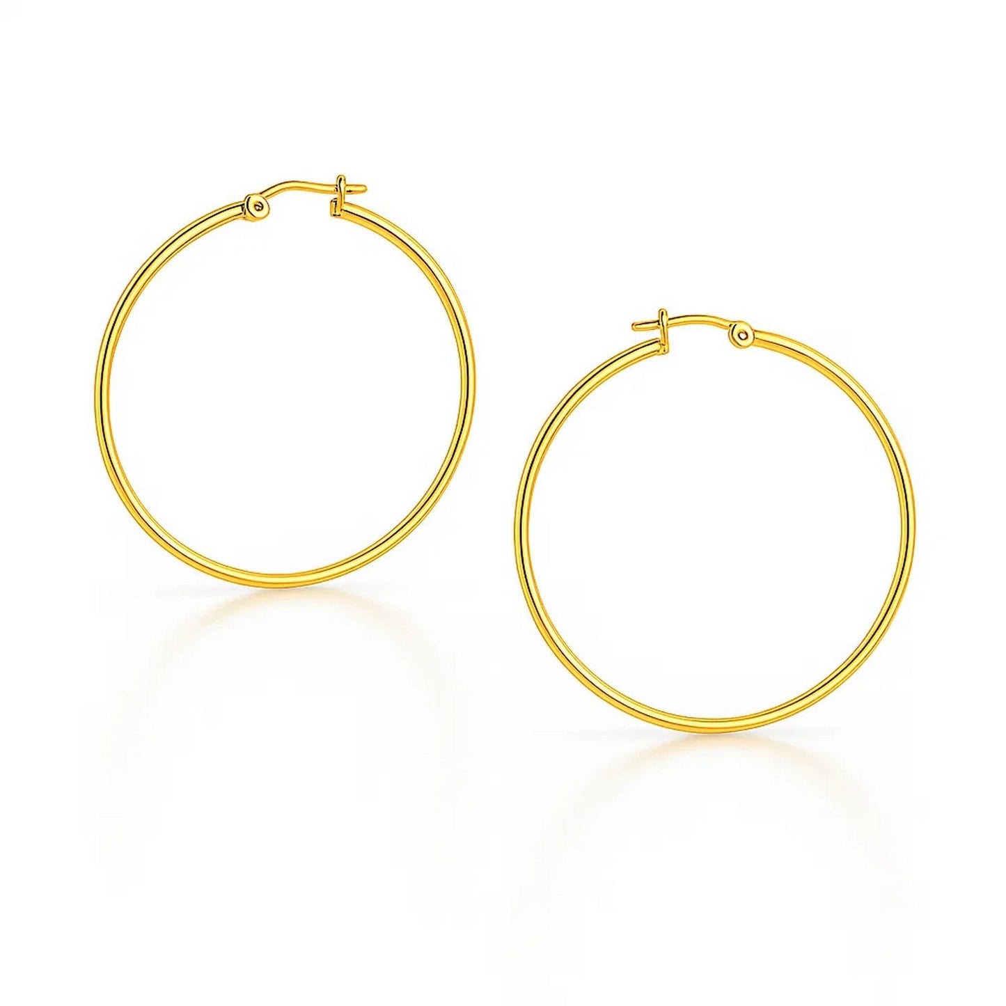 10k Yellow Gold Polished Hoop Earrings (3x25 mm) in a sleek high-contrast midnight luxury editorial style