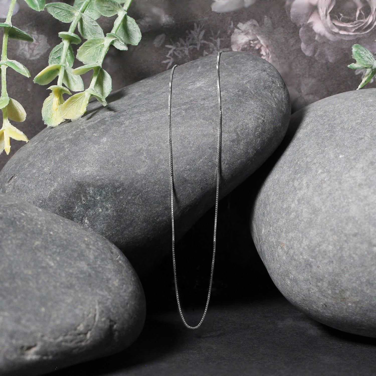 Peelerie jewelry piece in midnight luxury editorial product photo, high-contrast studio lighting