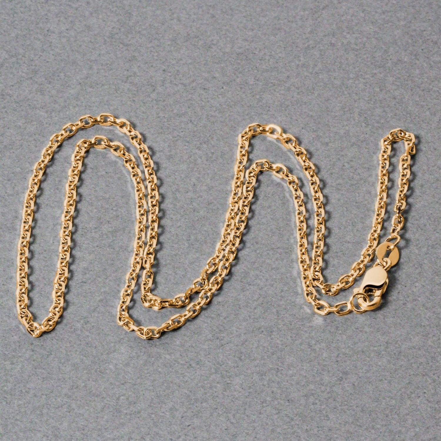 Peelerie jewelry piece in midnight luxury editorial product photo, high-contrast studio lighting