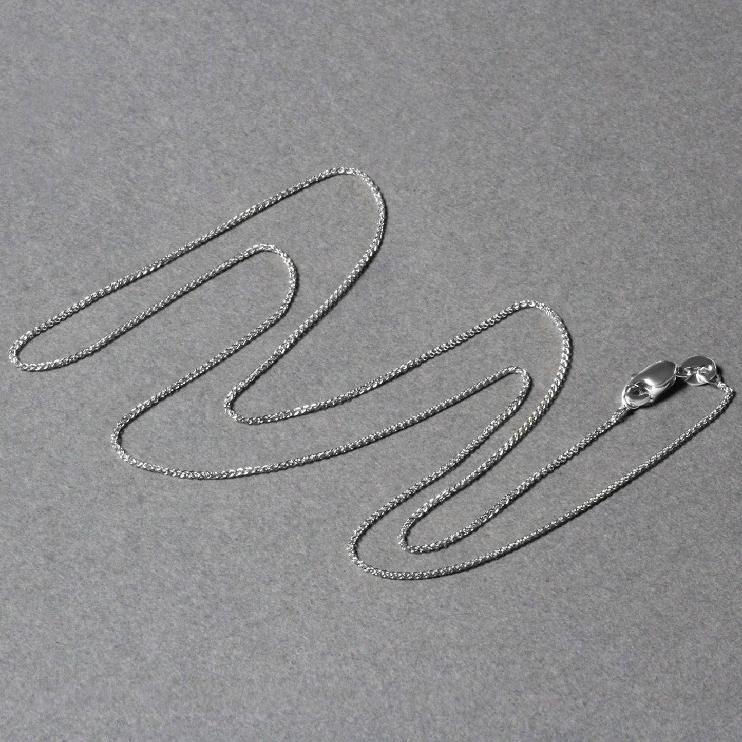 Peelerie jewelry piece in midnight luxury editorial product photo, high-contrast studio lighting