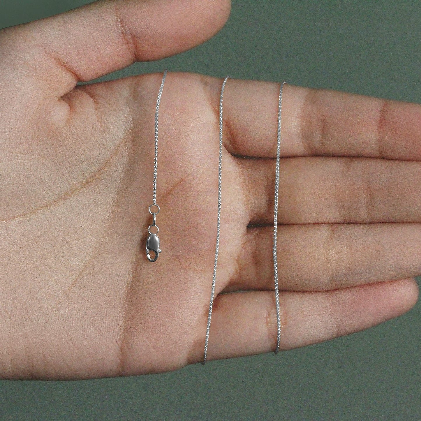 Peelerie jewelry piece in midnight luxury editorial product photo, high-contrast studio lighting