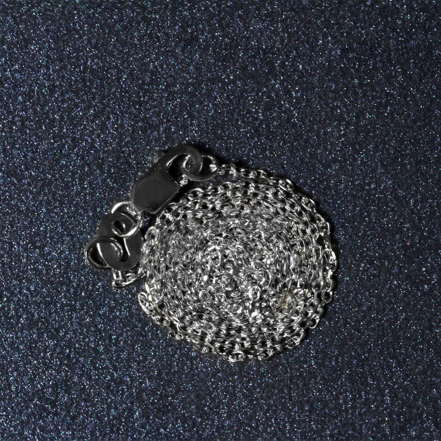 Peelerie jewelry piece in midnight luxury editorial product photo, high-contrast studio lighting