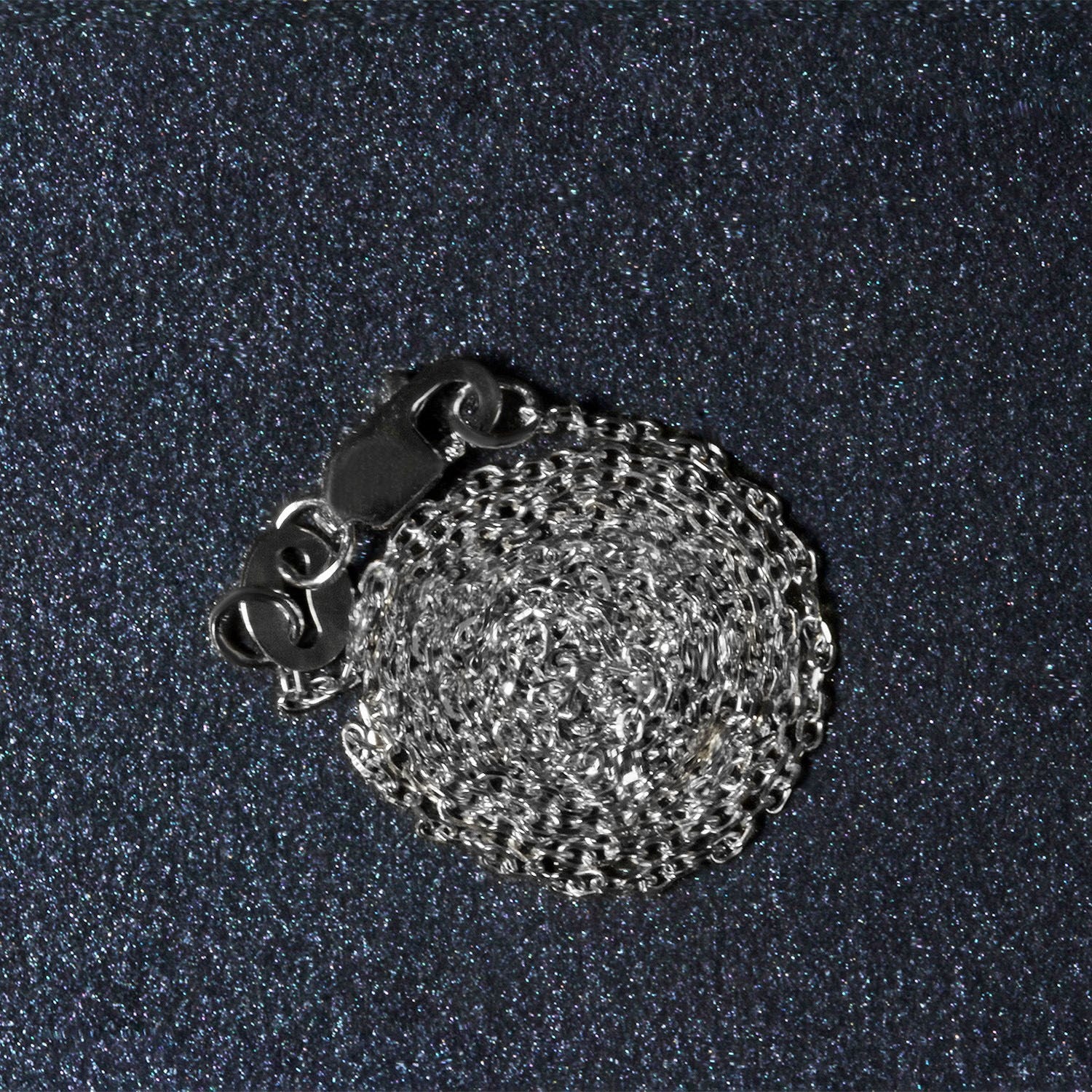 Peelerie jewelry piece in midnight luxury editorial product photo, high-contrast studio lighting