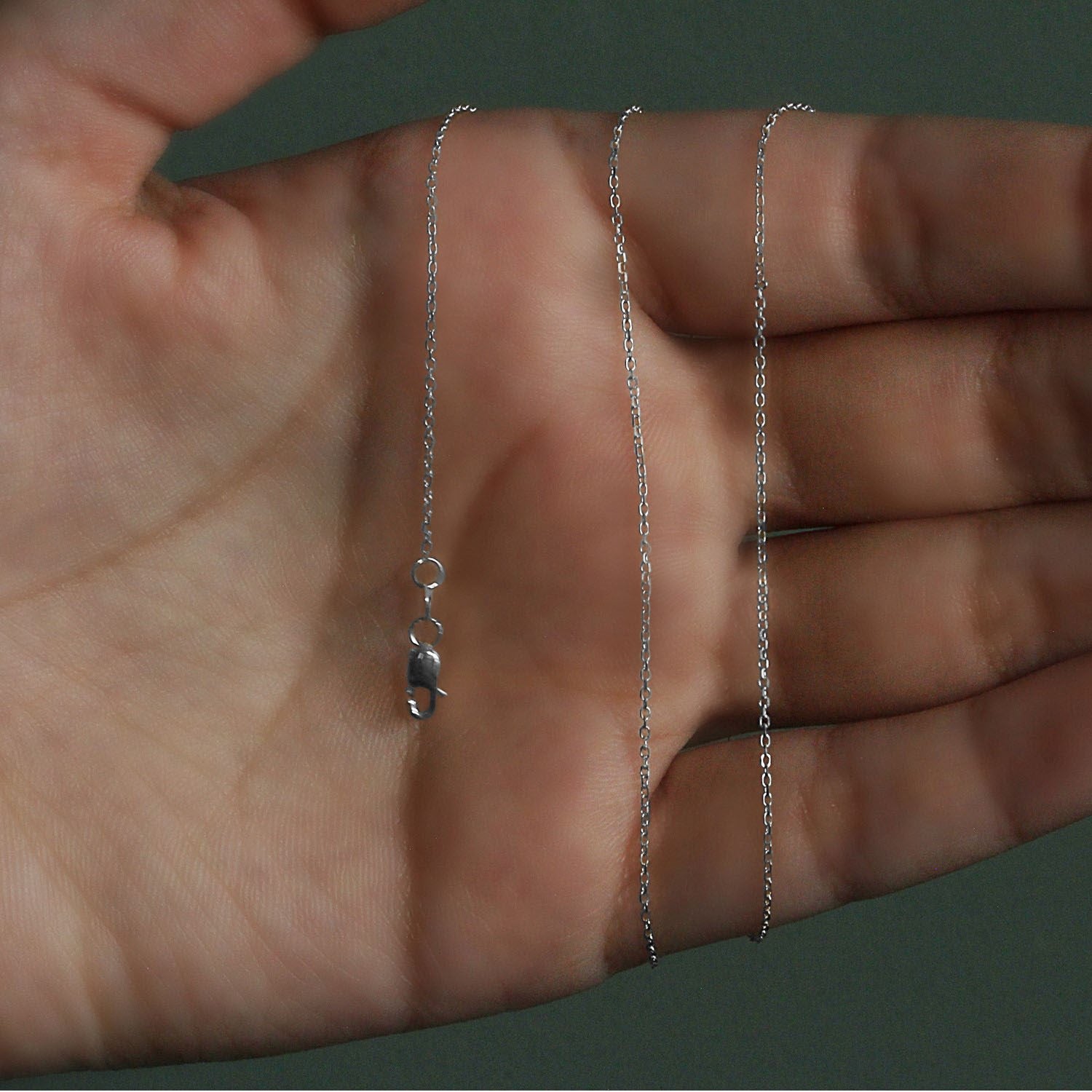 Peelerie jewelry piece in midnight luxury editorial product photo, high-contrast studio lighting