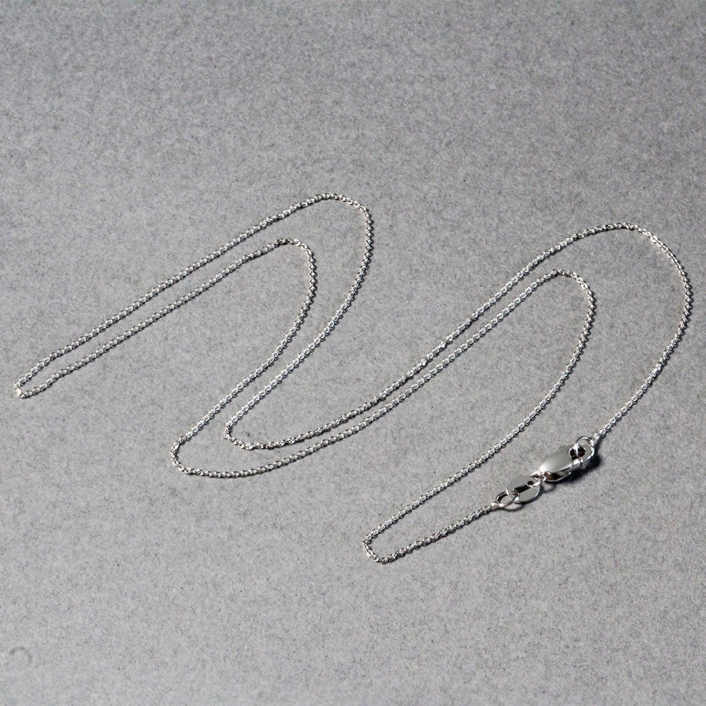 Peelerie jewelry piece in midnight luxury editorial product photo, high-contrast studio lighting