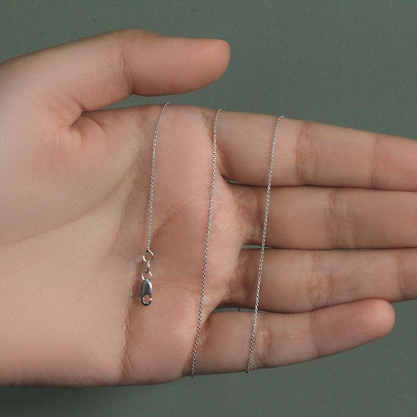 Peelerie jewelry piece in midnight luxury editorial product photo, high-contrast studio lighting