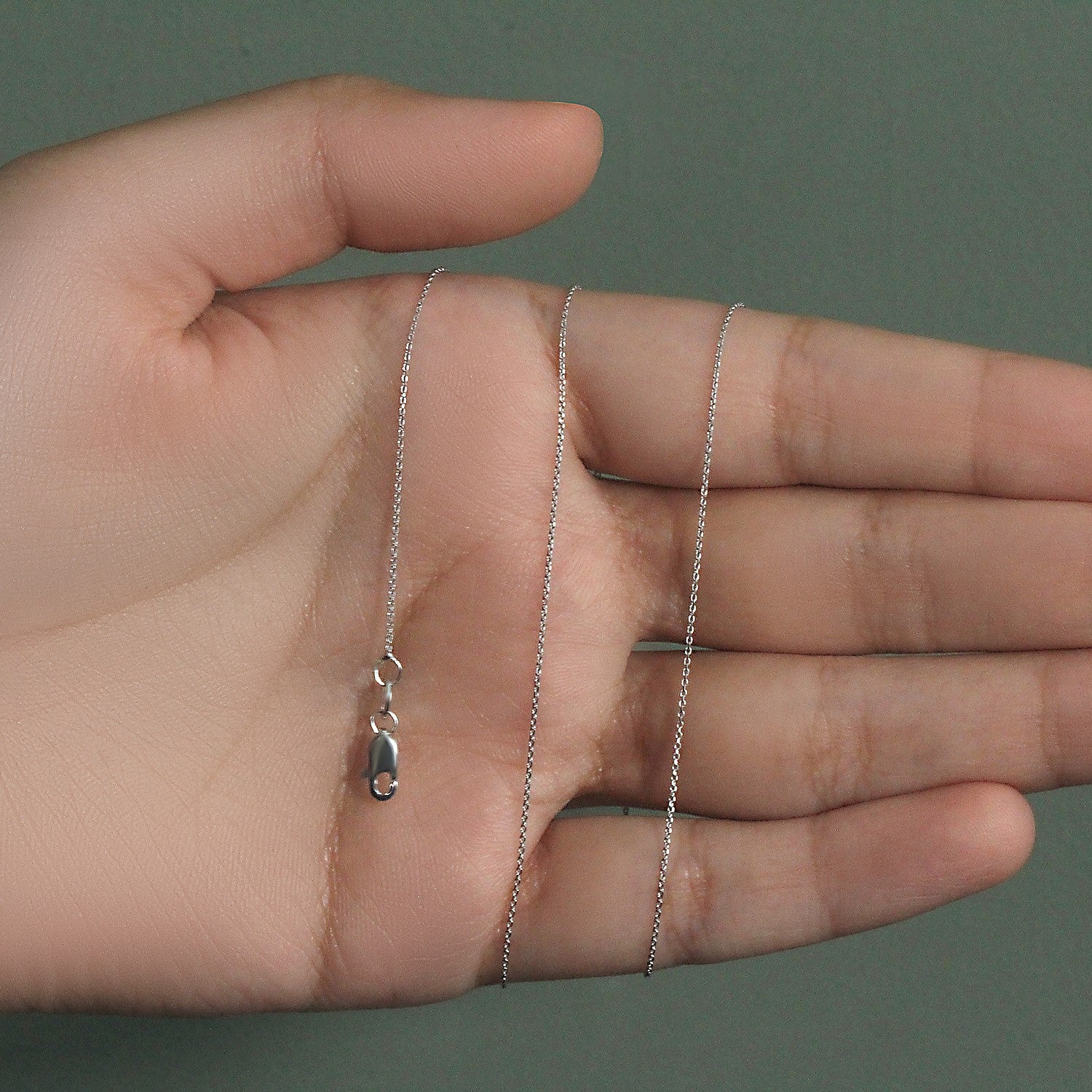 Peelerie jewelry piece in midnight luxury editorial product photo, high-contrast studio lighting