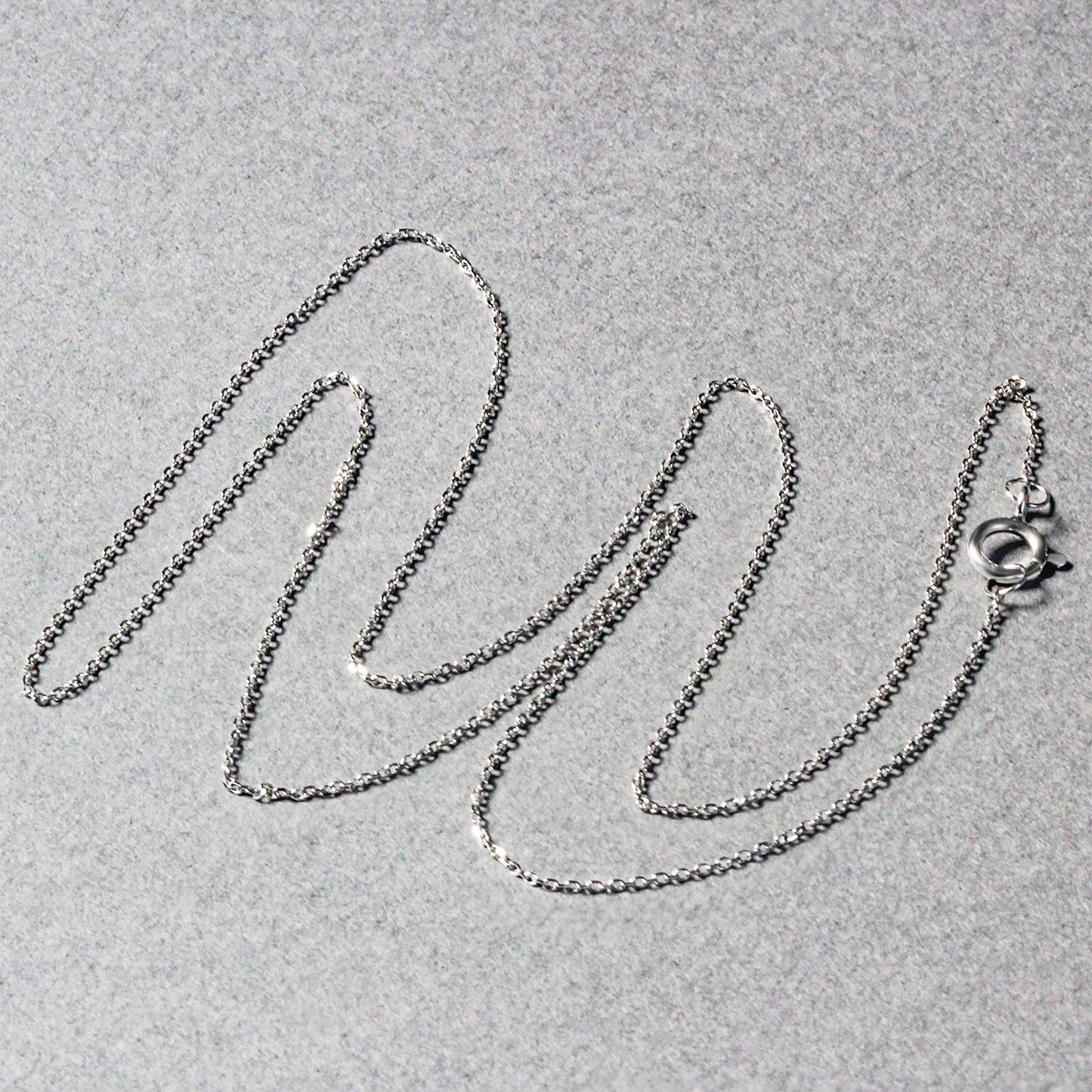 Peelerie jewelry piece in midnight luxury editorial product photo, high-contrast studio lighting