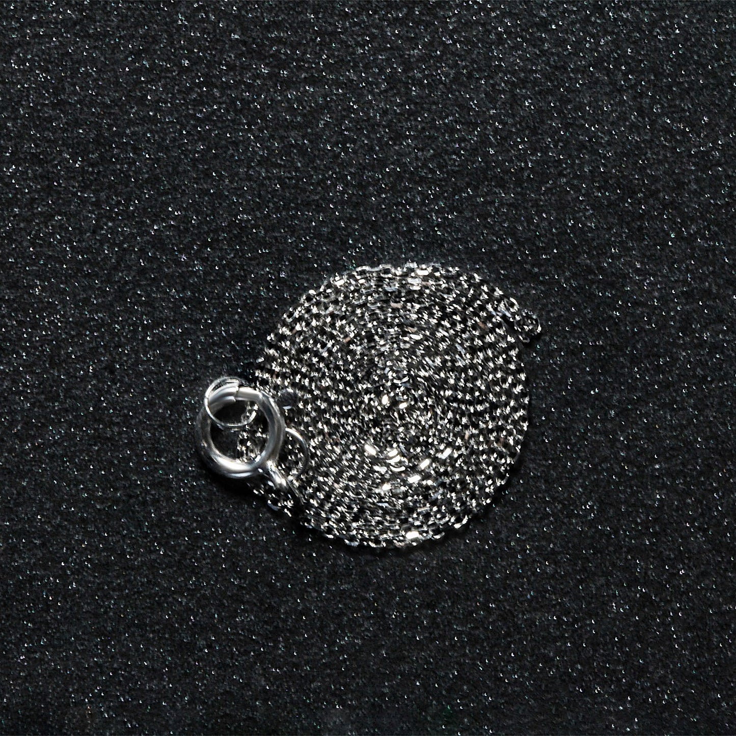 Peelerie jewelry piece in midnight luxury editorial product photo, high-contrast studio lighting