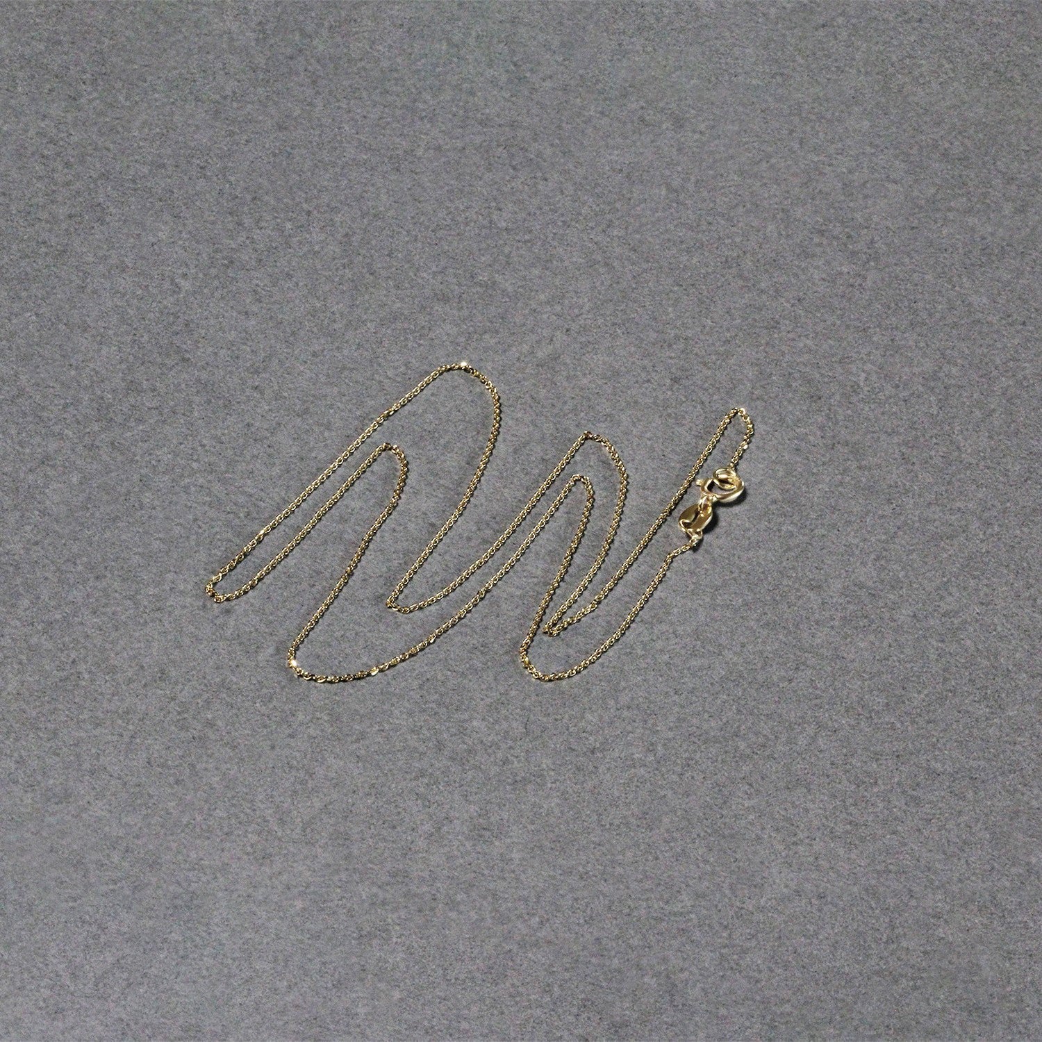 Peelerie jewelry piece in midnight luxury editorial product photo, high-contrast studio lighting