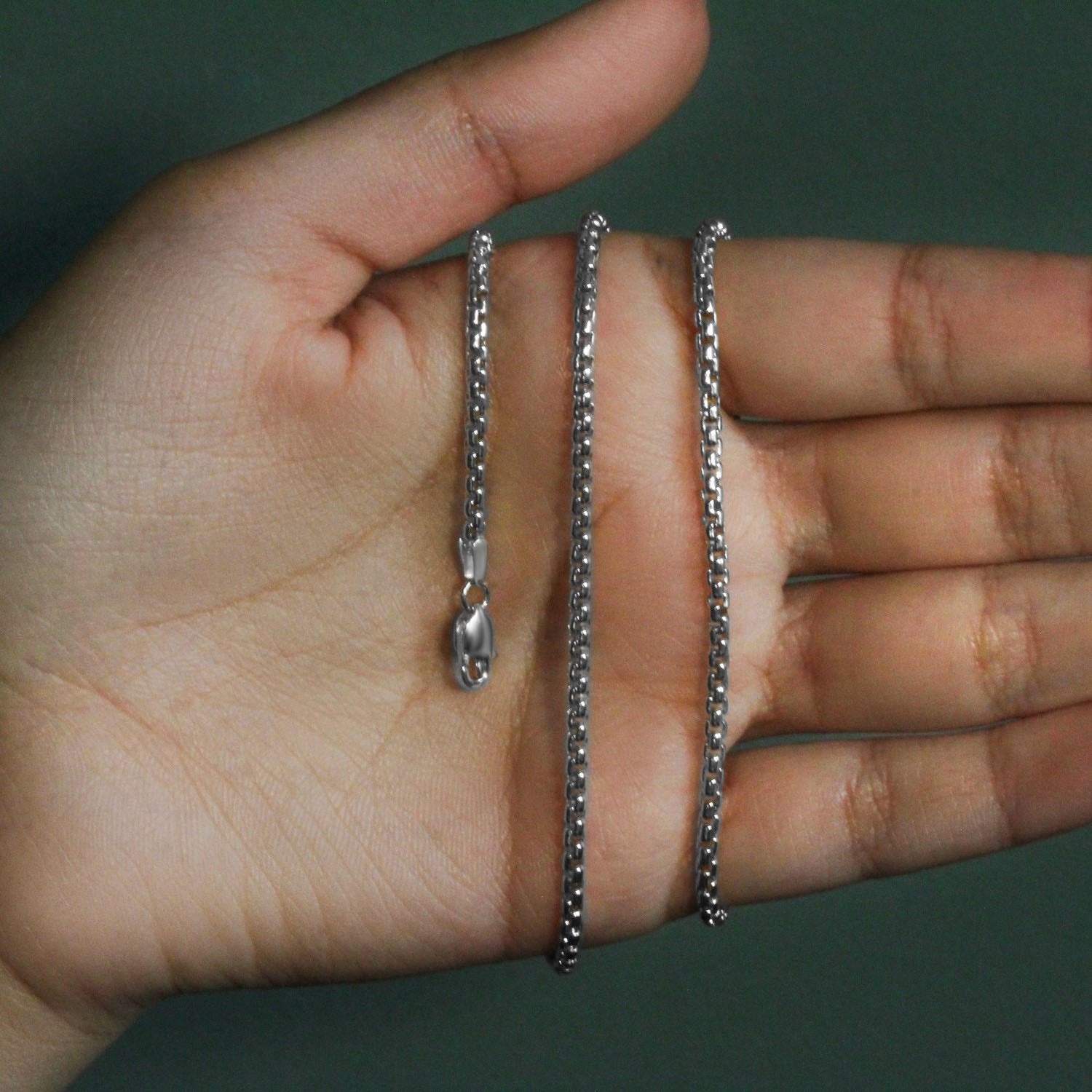 Peelerie jewelry piece in midnight luxury editorial product photo, high-contrast studio lighting