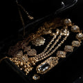 Luxury_jewelry_gift_macro_photo_extreme_close-up_of_black_velvet_jewelry_box_slightly_open_showing_gold_and_diamond_jewelry_sparkle_cinematic_spotlight_lighting_deep_shadows_high_cont_0484753b-bf99-4f4c-8437-42972498012e - Peelerie