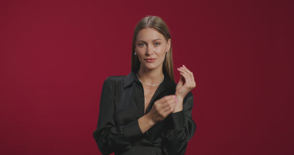 a woman wearing a tennis diamond bracelet
