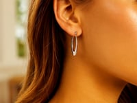 Boucles d'oreilles créoles ovales dégradées en or blanc 14 carats poli