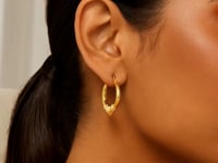 Boucles d'oreilles créoles cœur moyennes en or jaune 14 carats