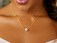Collier solitaire 14 carats en or jaune avec perle de 7 mm