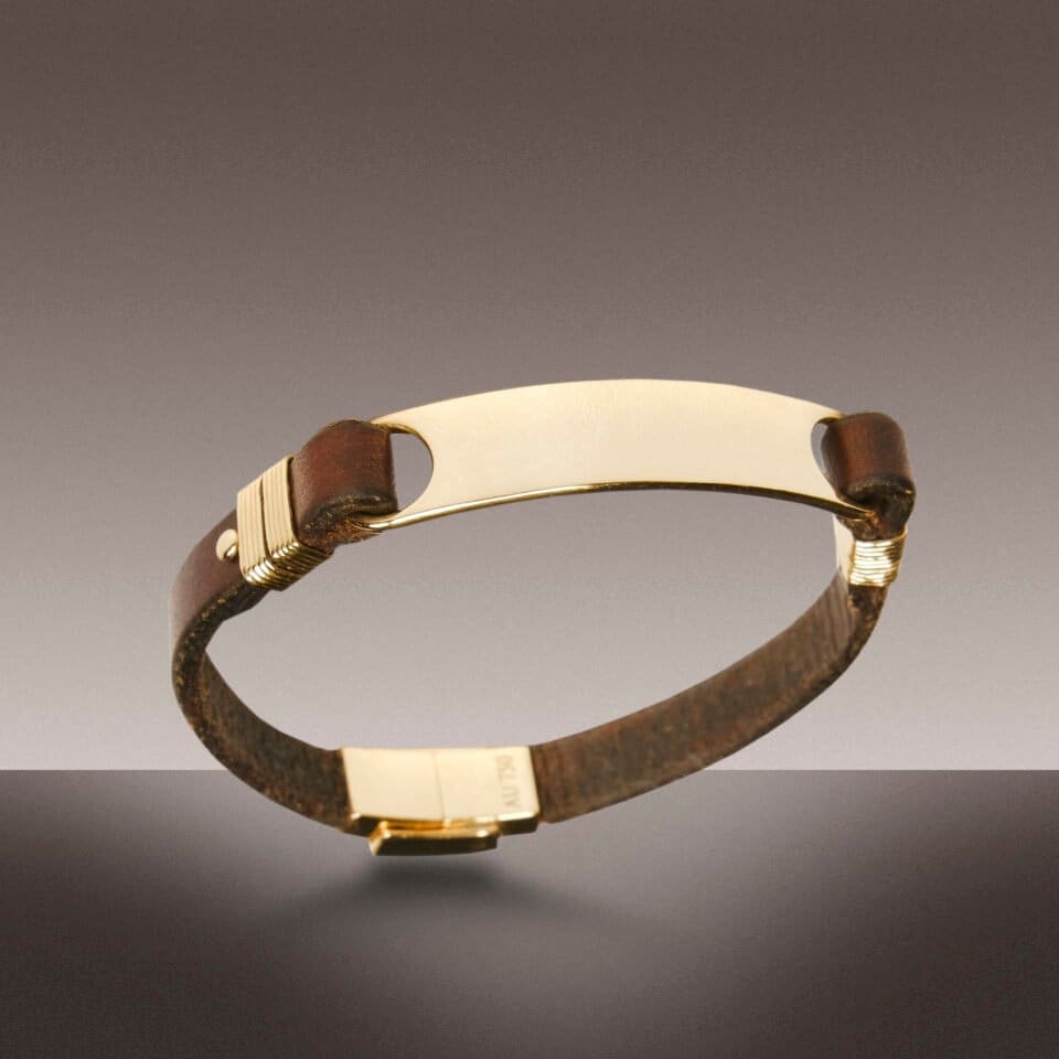 Leather bracelet with gold accents