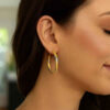 3x30mm polished hoop earrings in solid 14K two-tone gold, view 2