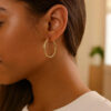 1.5x25mm polished hoop earrings in solid 14K yellow gold, view 5