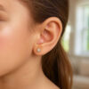 2 mm stud faceted white cubic zirconia earrings in solid 14K yellow and white gold, view 3