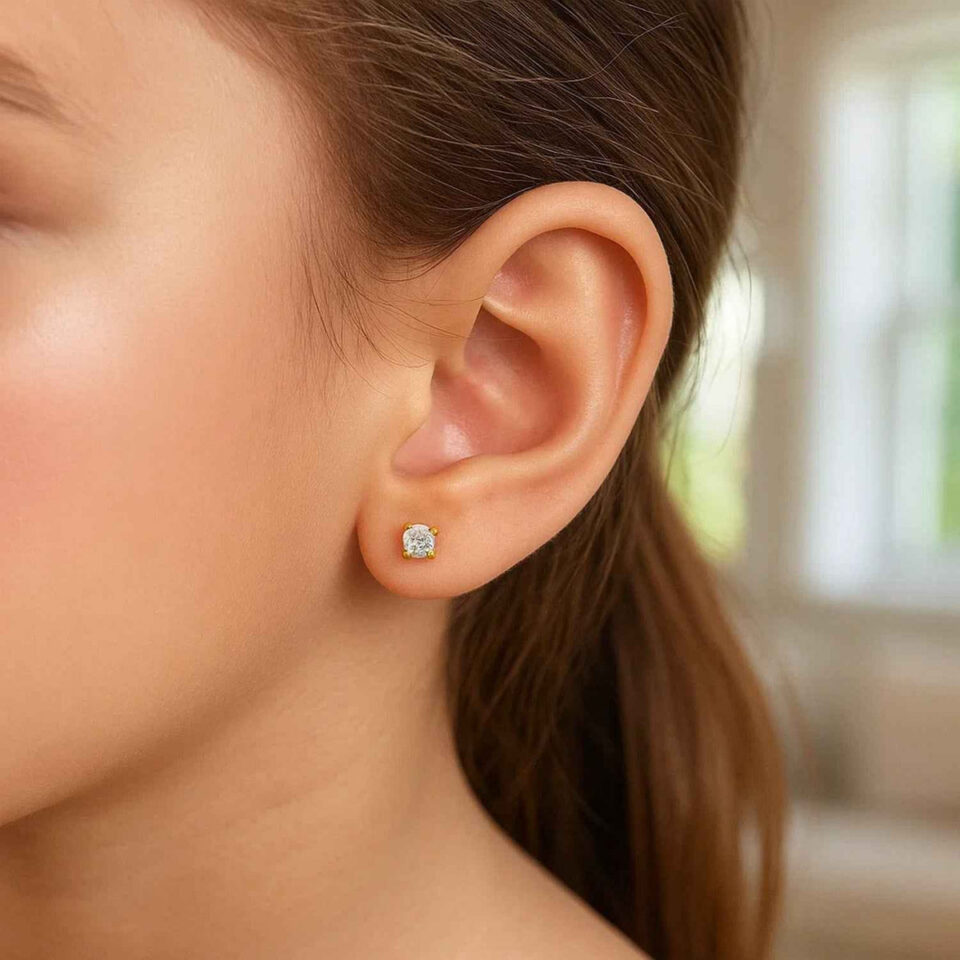 2 mm stud faceted white cubic zirconia earrings in solid 14K yellow and white gold, view 3
