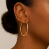 1.2 × 30 mm endless hoop earrings in solid 14K yellow gold, view 5