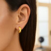 Hoop huggie earrings in solid 14K yellow gold, view 3