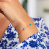 Blue topaz station bracelet in solid 14K yellow gold, view 3