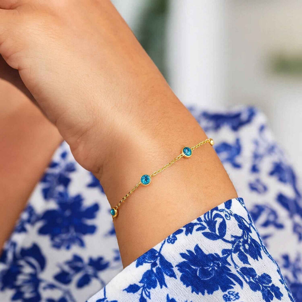 Blue topaz station bracelet in solid 14K yellow gold, view 3