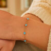 Blue topaz station bracelet in solid 14K yellow gold, view 4