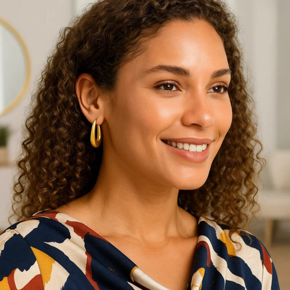 Graduated oval hoop earrings in solid 14K yellow gold, view 2